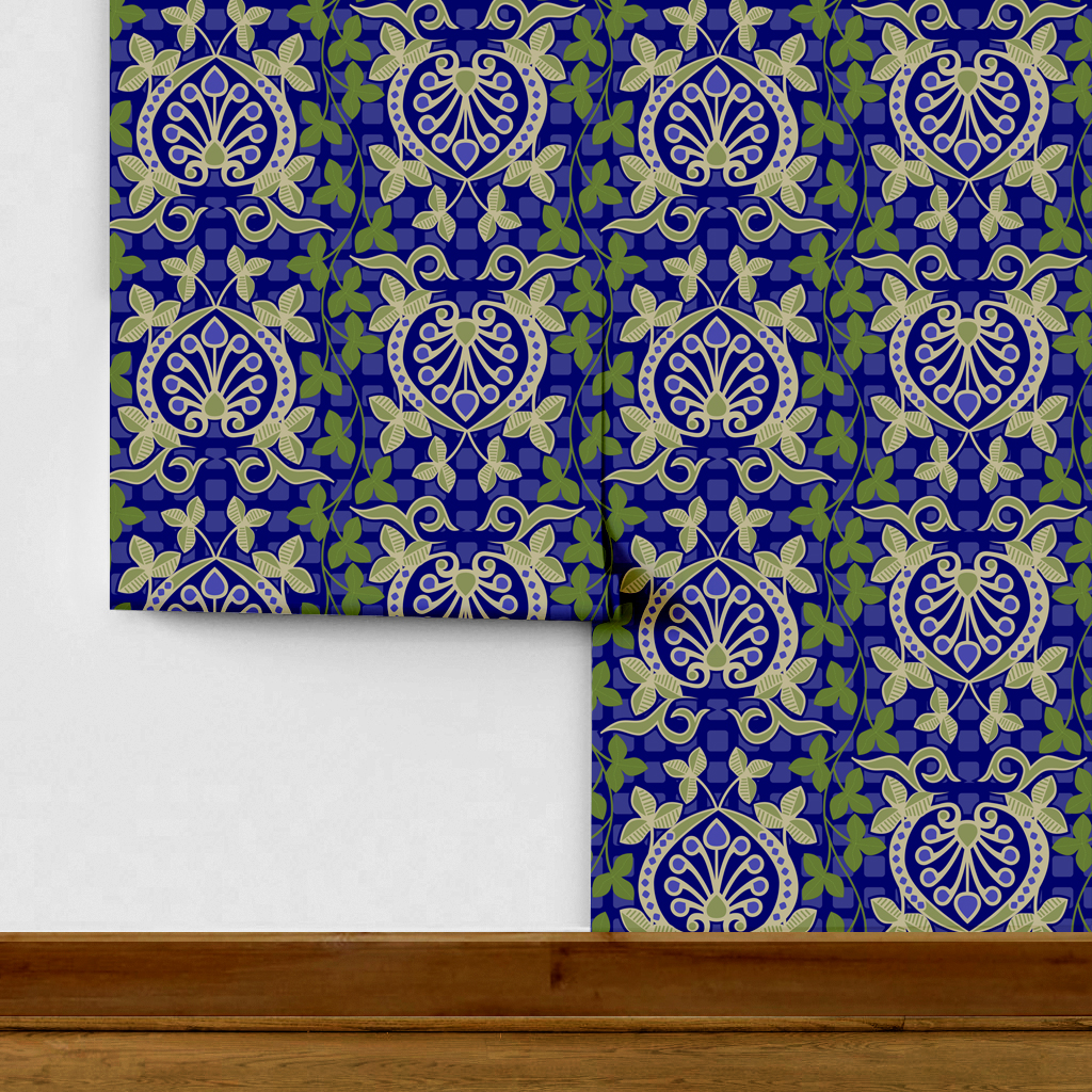 Pomegranate is a seamless repeating pattern featuring stylized heart-shaped floral motifs. Each motif has a central symmetrical design with curling tendrils and small circular shapes radiating from a rounded base. Surrounding these heart-shaped forms are pale green leaves and vines that interlock smoothly, creating an intricate lattice effect. The background is a deep blue, enriched by a subtle checkerboard texture that adds depth and contrast. The overall composition is balanced and harmonious, with elegant curves and a vintage aesthetic reminiscent of traditional textile designs. The dominant colors are dark blue, olive green, and muted beige, highlighting the natural and ornamental qualities of the pattern.
